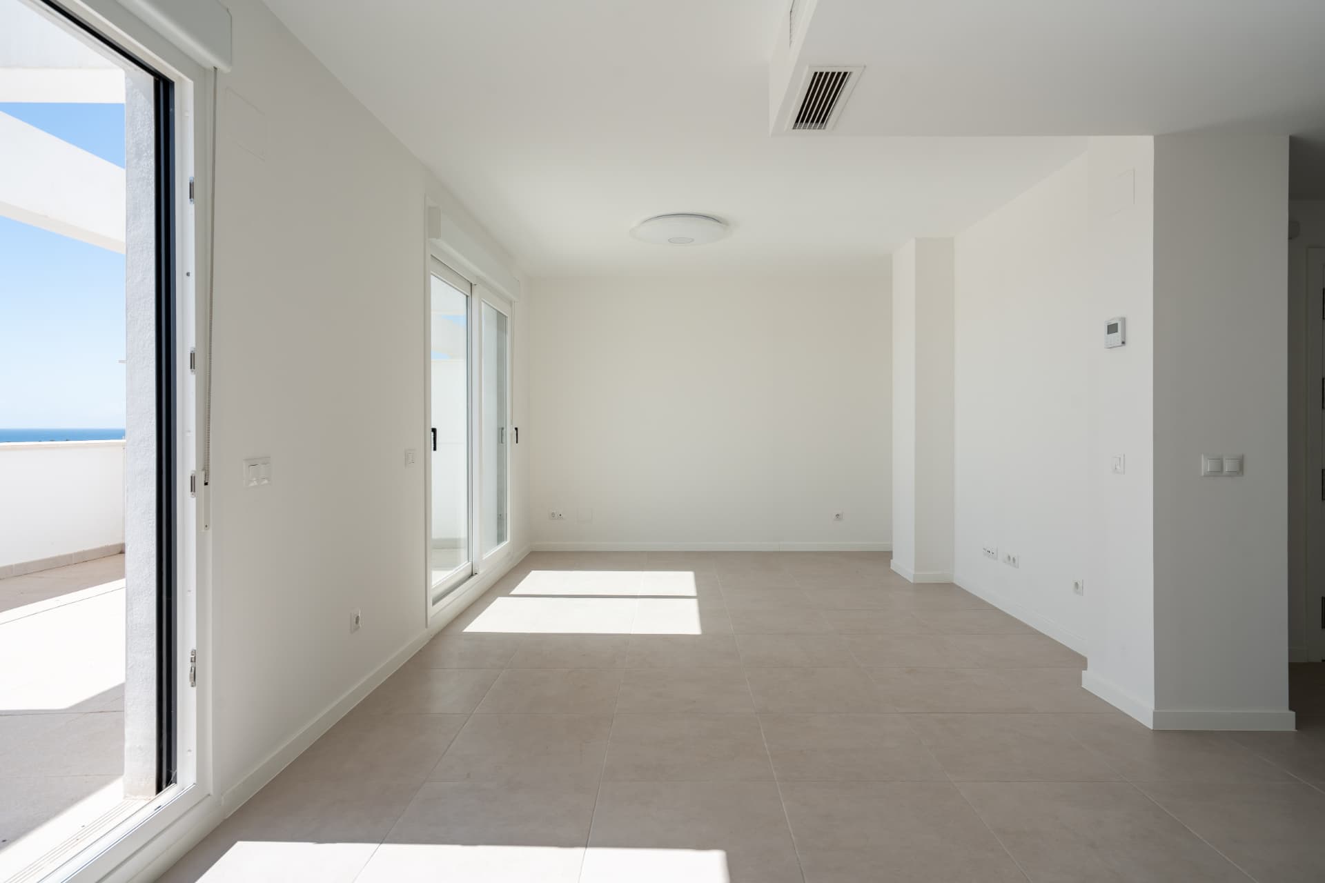 Bright living space with full-height terrace doors