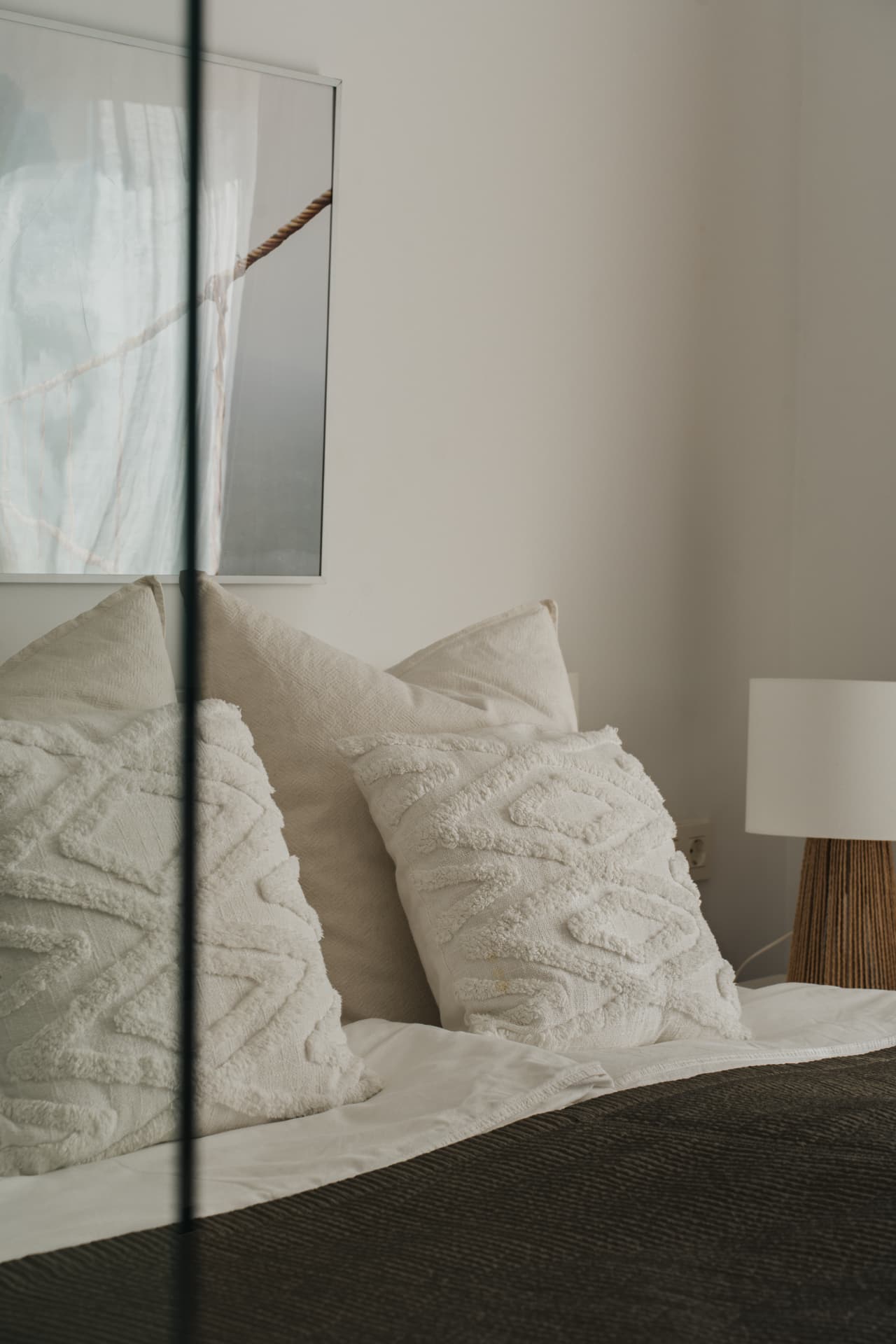 Bedroom detail with textured cushions