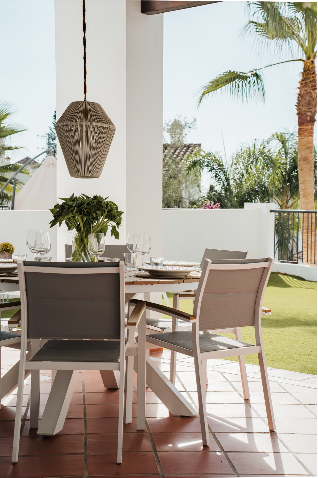 Covered terrace dining with garden view