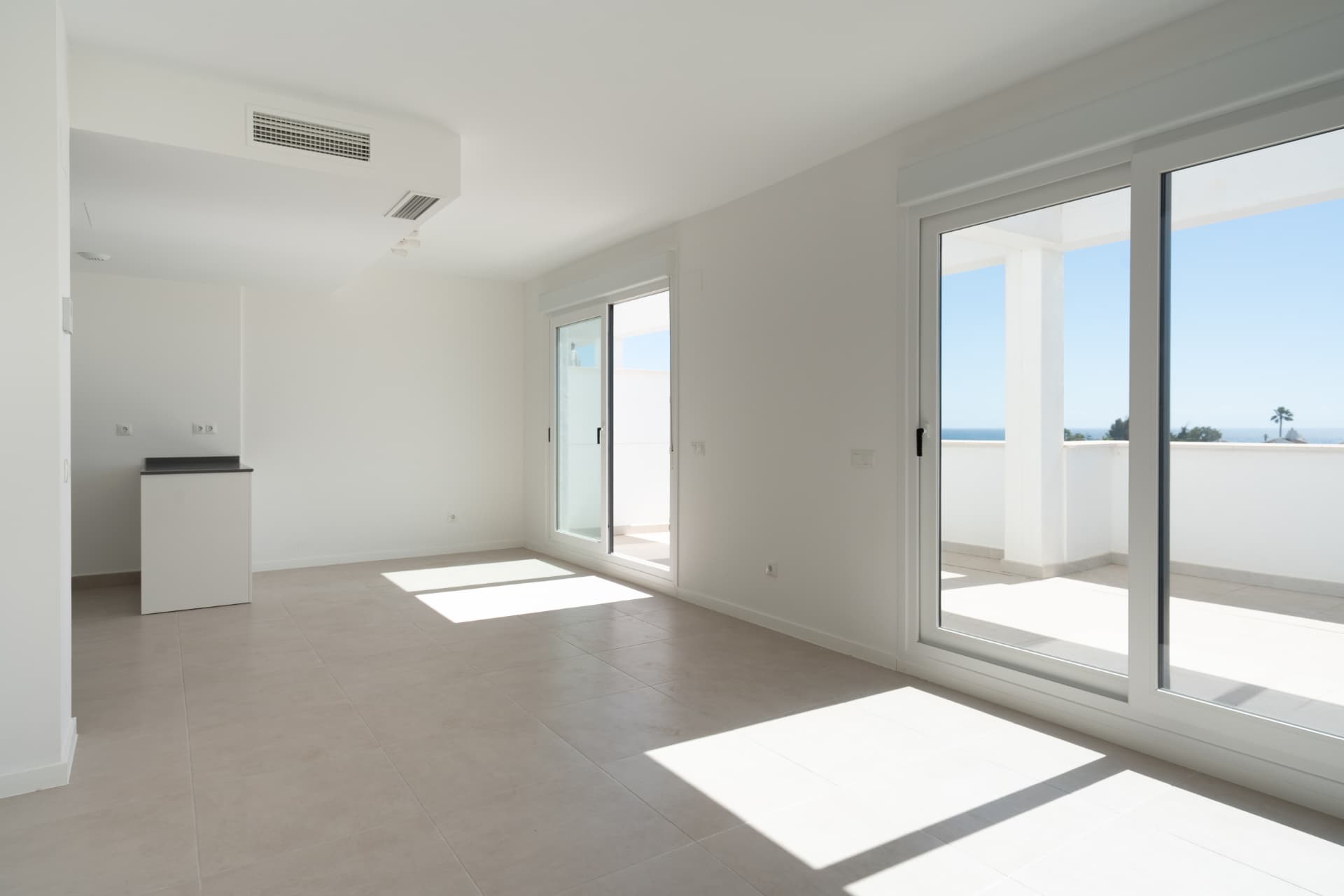 Living room with sliding doors to the sea-view terrace