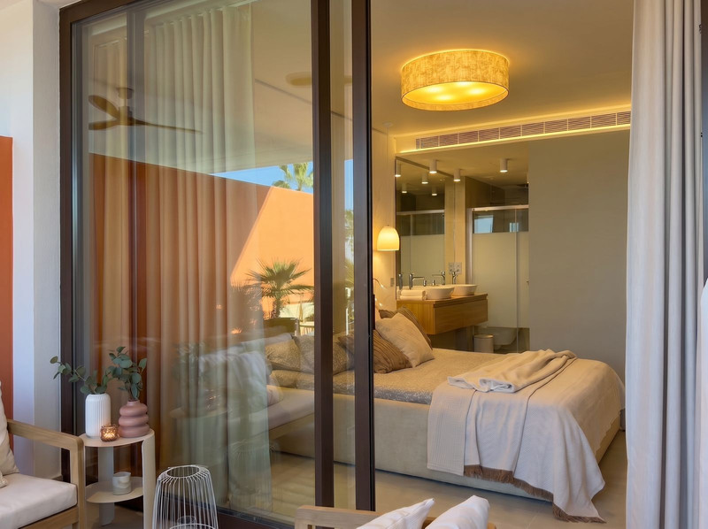 Bedroom seen through sliding glass doors