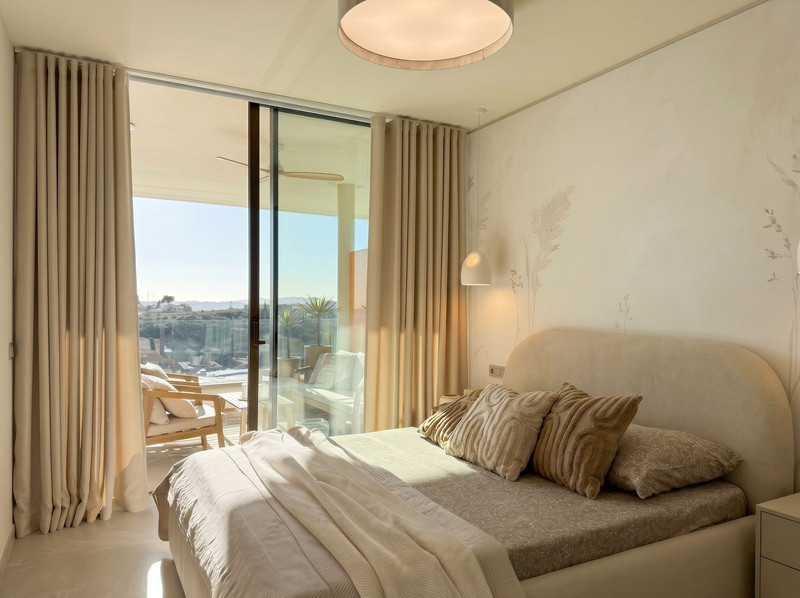 Bedroom with balcony view